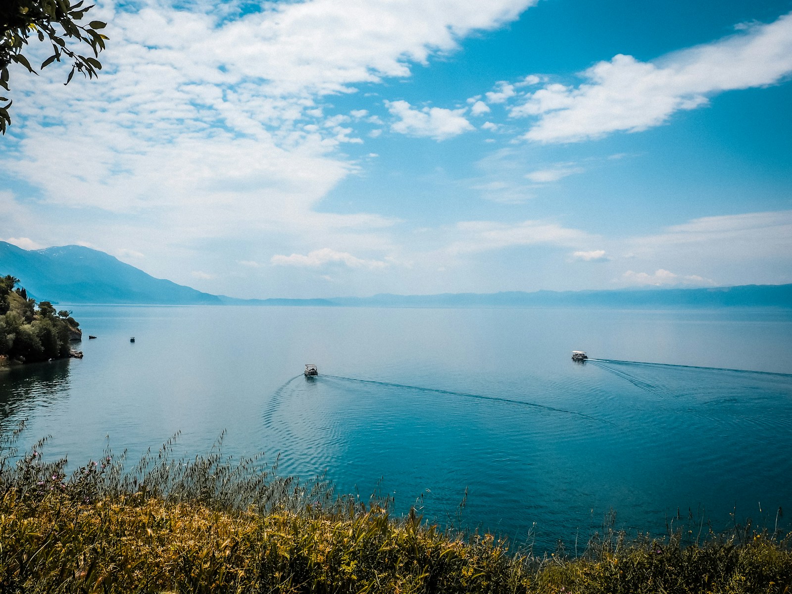 a boat traveling across a large body of water